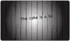The Cake is a Lie Playmat - Old Hat Studios - Mockup