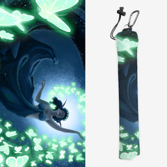 Playmat bag of Nature's Aegis by Chloe Janowski. A female elf in a long flowy dress reaches out to a flock of glowing green butterflies. The moon is behind them. 