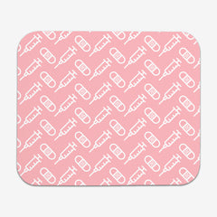 A pink classic mousepad with a white pattern of bandages and vaccines
