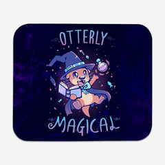 Classic Mousepad of Otterly Magical by TechraNova. A cute otter in a witch hat and cape. It holds a book and a bottle. Fish and sparkles are around the otter. 