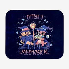 Classic mousepad of Otterly Meowgical by TechraNova. A cat and an otter dressed in witch hats and capes read from a spell book. Fish are swimming around them. 