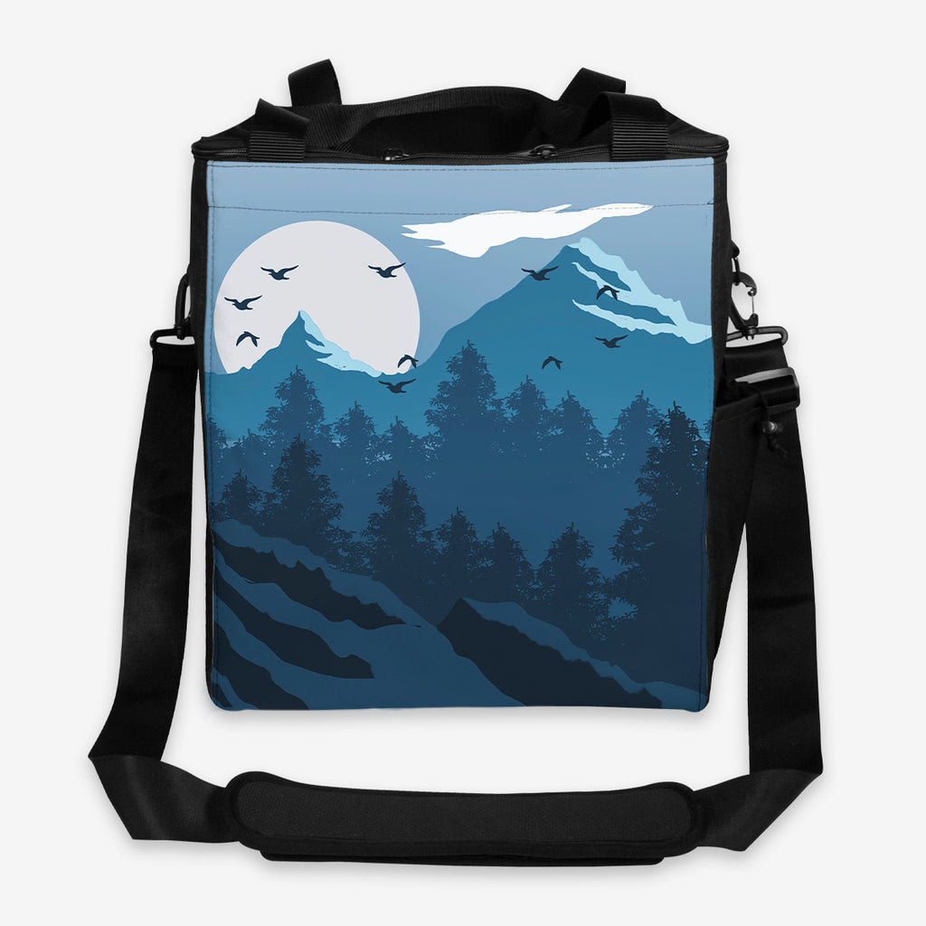 Blue Winter Forest gaming crate by Carbon Beaver. Landscape in shades of blue . The sun is setting behind the mountains and birds are flying in the sky.