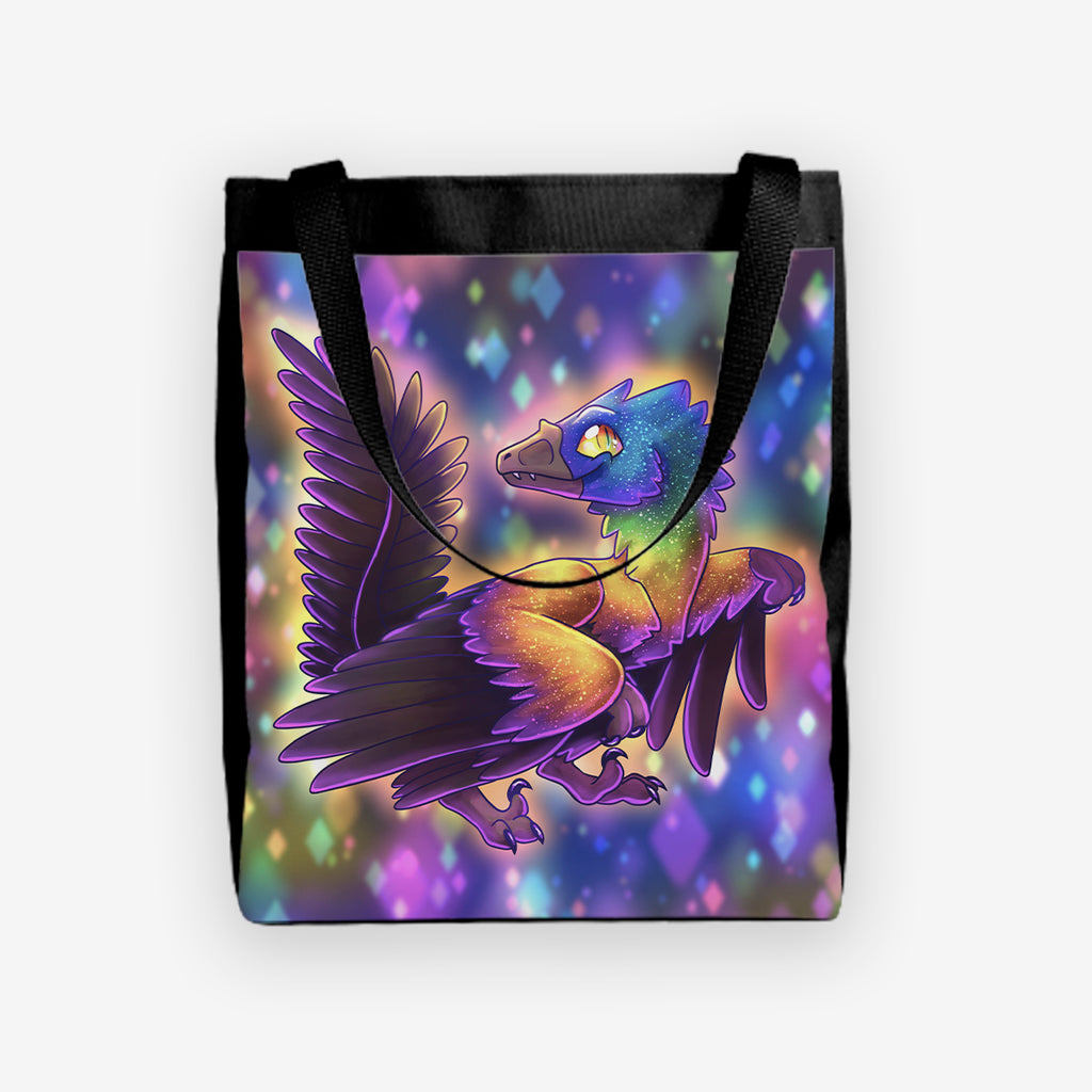 The front of Caihong by Ian Haramaki. A Cute feathered dinosaur sits at the center of this tote. It has bright neon purple, blue, orange, and black feathers. In back ground are abstract star shapes.