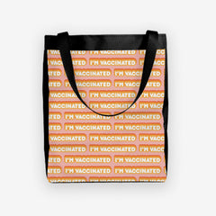 A pink day tote with a orange and white bubble text pattern. The text that reads “I’m Vaccinated” is in white. Each of these has orange behind them, from the lightest shade to the darkest shade.