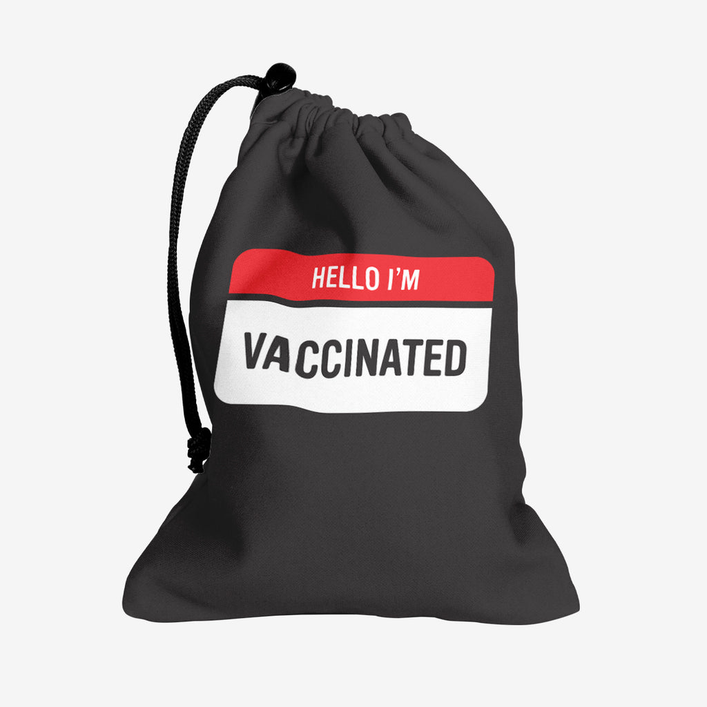 A black dice bag with a red and white label at the center. The red part of the label reads “Hello I’m” in white text. The white part of the label reads “Vaccinated” in black text.