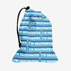 A blue dice bag with a blue and white bubble text pattern. The text that reads “I’m Vaccinated” is in white. Each of these has blue behind them, from the lightest shade to the darkest shade.