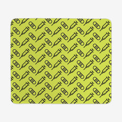 A green large gaming mousepad with a black pattern of bandages and vaccines