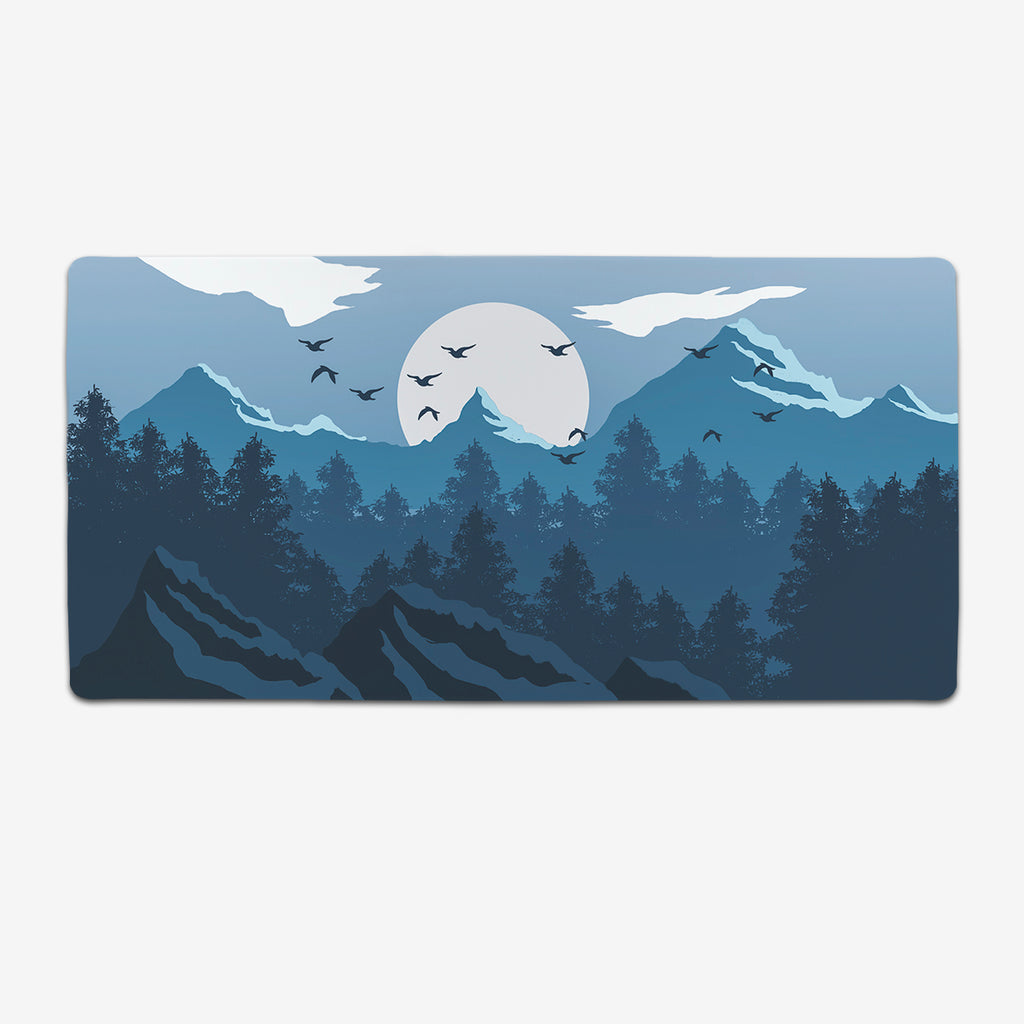 Blue Winter Forest XL extended mousepad Carbon Beaver. A mountain landscape in shades of blue. The sun is setting and birds are flying in the sky.