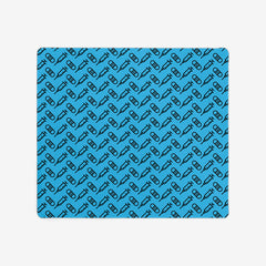 A blue extra large gaming mousepad with a black pattern of bandages and vaccines