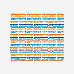 A white extra large gaming mousepad with an orange, blue, and white bubble text pattern. The text that reads “I’m Vaccinated” is in white. Each of these has orange or blue behind them, from the lightest shade to the darkest shade.
