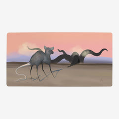 Desert Rat by Morgan Hawthorn. Large grey rat looks at black tentacles in a desert. The sky is pink.