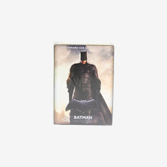 Front of the box for Dragon Shield DC Matte Art Sleeves. Batman a person in black armor and cape stands in front of a cloudy background.