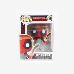 Front of the box for the Larp Deadpool Funko Pop! Deadpool a figure with a large head stands with a wooden sword. He has a black and red mask, a belt around his head, a sheet held together with a safety pin made to look like a toga, and grey shoes.