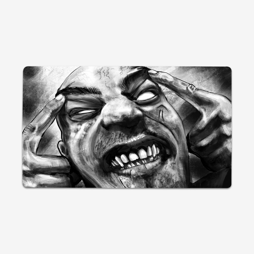 Playmat of Infected Mind by Why Try Designs. A black and white drawing of a man with his hands on his head. He is making a face as if he's in pane. His eyes are all white, he has scars on his face, and all his teeth are showing.