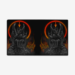 Wrong Heaven by Why Try Designs. On half of the playmat a black and gray demon sits on a throne on top of a pile of skulls. There is a ring of fire behind the demon creating a halo, and flames coming off of the skulls. This image is reflected on the other side of the playmat.